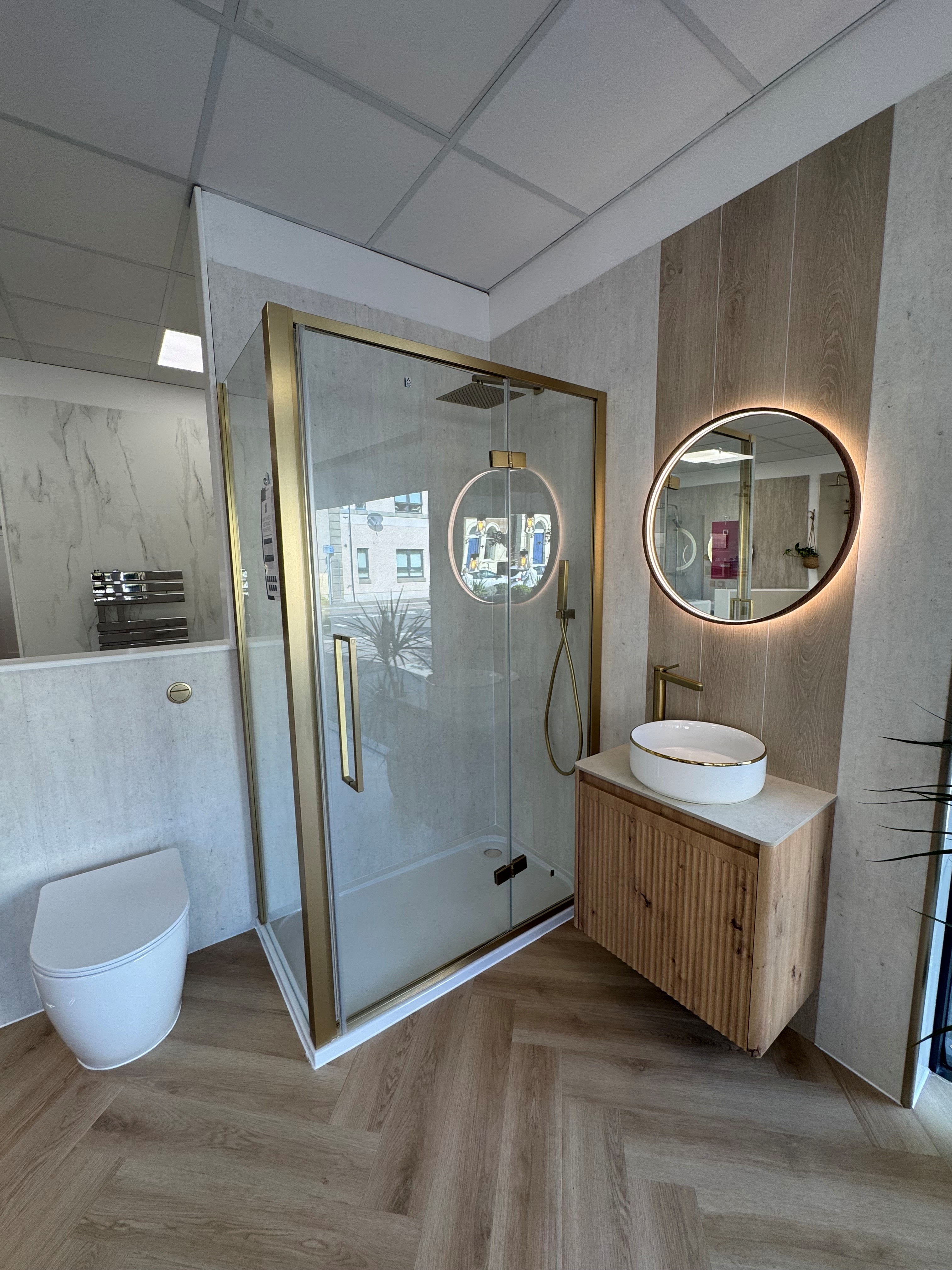 Display 5 showing tile affect wetwall will feature wall above basin, brushed brass shower mixer with 2 outlets. btw basin with concealed cistern